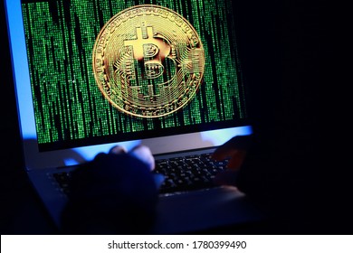 Hacker with computer hacking and stealing data information, Selective focus image on keyboard, Bitcoin logo and binary code as background. Bitcoin cryptocurrency security and privacy issues. - Powered by Shutterstock - Get 15% off with code: PIKWIZARD15