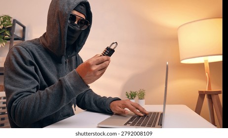 A hacker examines a padlock, symbolizing an attempt to crack security codes. This scene highlights digital vulnerability, data protection, password hacking, and the constant threat to cybersecurity.