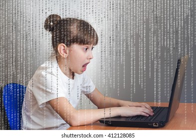 Hacker girl enjoys playing in a laptop