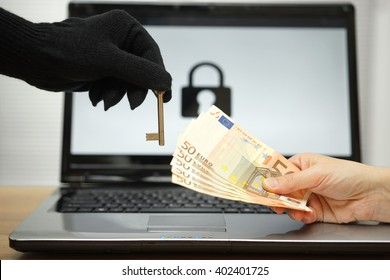 hacker gives key to victim to restore the personal data on laptop computer - Shutterstock ID 402401725