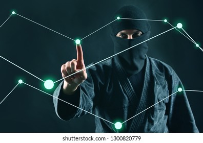 Hacker. Hacking computer data process. Man in the mask works with a digital security diagram.