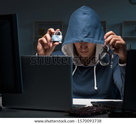 Hacker hacking computer at night