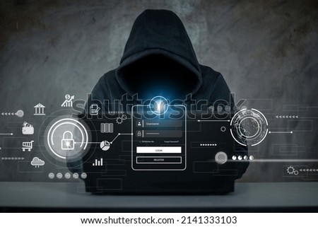 Hacker, hacker hacks network, hacker on a dark background. Dangerous Hooded Hacker Breaks into Government Data Servers