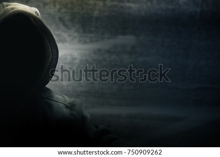 Hacker half face and black head and grunge background, terrorism and internet criminal cyber concept