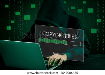 Hacker hands Data transfer File copying process laptop screen. Cybercrime, hacking digital breach, theft, and illegal activity.Concept digital Technology cybersecurity.