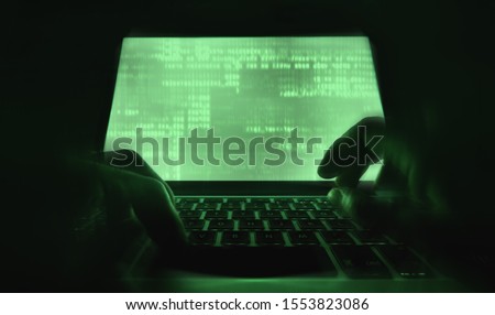 hacker hands at work with  interface around