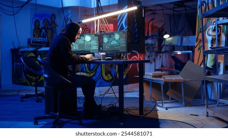 Hacker in hidden base successfully getting past anti tamper measures implemented by companies to protect products. Cracker pirating software and video game releases, camera A handheld camera shot