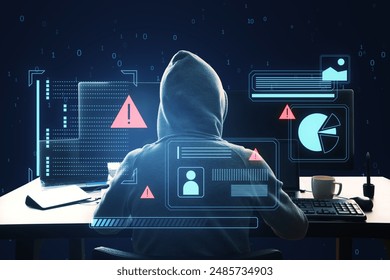 A hacker with a hood in front of a computer, digital graphs and security warning signs, dark blue background, concept of cyber security - Powered by Shutterstock