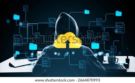 Hacker in hoodie using computer with cloud upload icon, digital folders and files in holographic style on dark background, cyber data concept