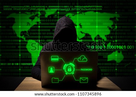 hacker in a jacket with a hood with a laptop sits at the table. Added identity theft icons, account hijacking, bank data theft and world map.