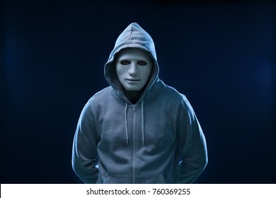 Hacker In Mask On Dark Background