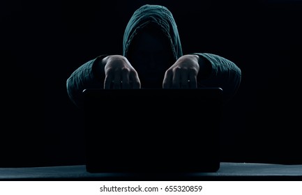 Hacker on a dark background                               