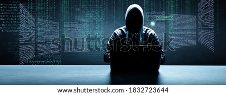 Hacker prints a code on a laptop keyboard to break into a cyberspace