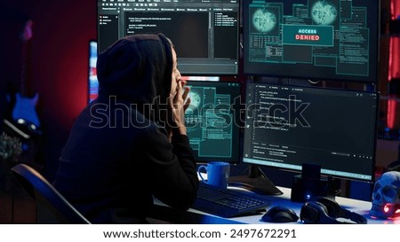 Hacker receiving access denied error message after being contracted by company in secret to do corporate espionage and steal information on competitor products to gain marketplace advantage, camera A