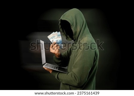 Hacker steal personal data from laptop and gets the money isolated on black background.