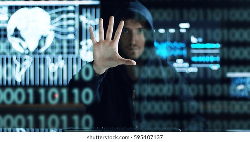 Hacker tries to enter the system using codes and numbers to find out the security password.The hacker enters the software to steal login information.Concept: immersive technology,augmented reality