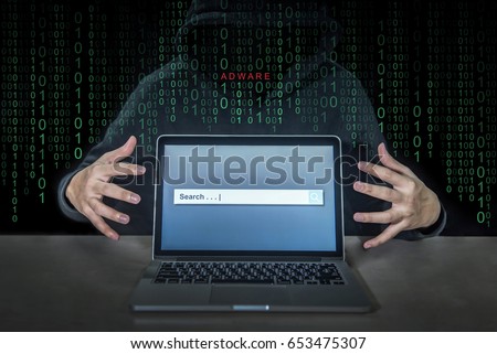 Hacker using adware fireball to control laptop computer using web browser search engine to spy and steal information. Internet security cyber attack hijack concept.