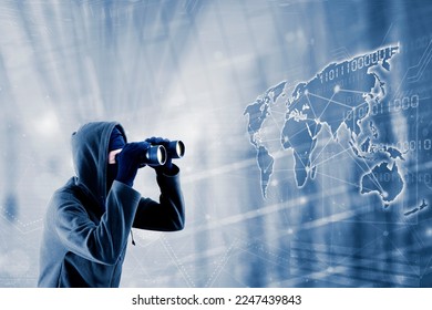 Hacker using binocular looking for new victims on the world map
