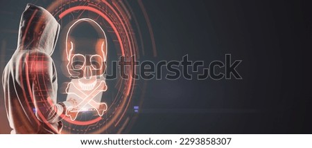 Hacker using computer with digital red skull on wide dark background with mock up place. Ransomeware, virus and pirate threat concept. Double exposure