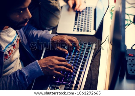 Hacker using keyboard typing phishing on the internet