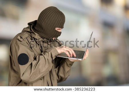 Hacker using laptop