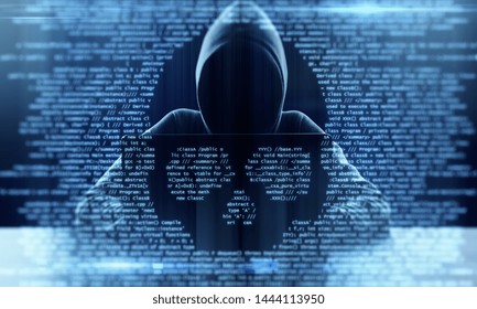 Hacker using laptop with abstract skull shape binary code. Hacking and criminal concept. Double exposure 