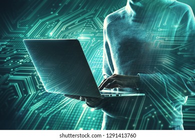 Hacker using laptop with circuit. Computing and technology concept. Double exposure 