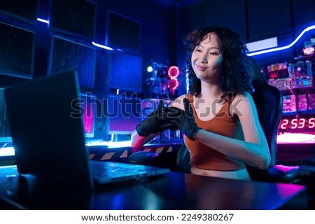A Hacker is using laptop computer to steal data in the night