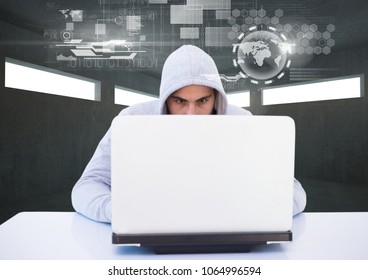 Hacker using a laptop in a dark room