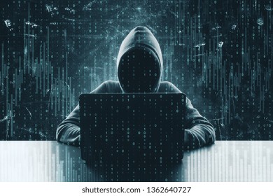 Hacker using laptop at desktop with forex chart. Technology and finance concept. Double exposure 