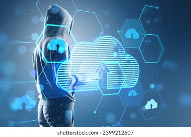 Hacker using laptop with glowing hexagonal cloud computing hologram with binary coding on blurry background. Safety, hacking, malware and internet concept. Double exposure
