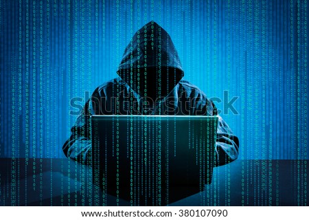 Hacker using laptop. Hacking the Internet.