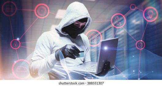 Hacker using laptop to steal identity against abstract glowing black background