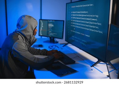 Hacker Using Multiple Computers For Stealing Data On Desk.