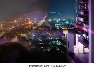 Hacker will hacking and steal data information in data center room and blending with cityscape panorama at night