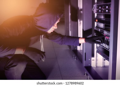 Hacker will hacking and steal data information in data center room.