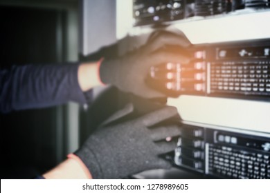 Hacker will hacking and steal data information in data center room.