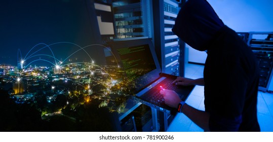 Hacker will hacking and steal data information with usb drive in the server room of technology data center and blending with city landscape at night with mesh network telecommunication connection