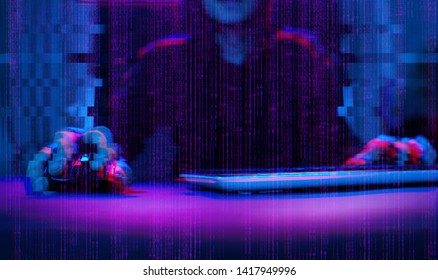 Hacker working with computer in dark room with digital interface around. Image with glitch effect.