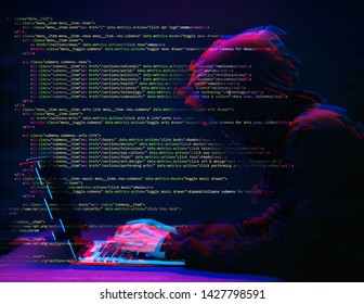 Hacker working with laptop in dark room with digital interface around. Image with glitch effect.