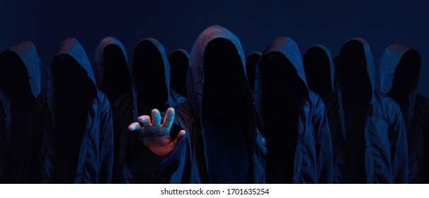 Hackers army. Dangerous hooded group of hackers. Internet, cyber crime, cyber attack, system breaking and malware concept. Dark face. Anonymous.