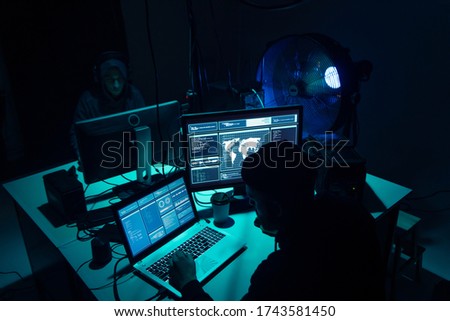 Hackers breaking server using multiple computers and infected virus ransomware. Cybercrime, technology, phishing mail concept.