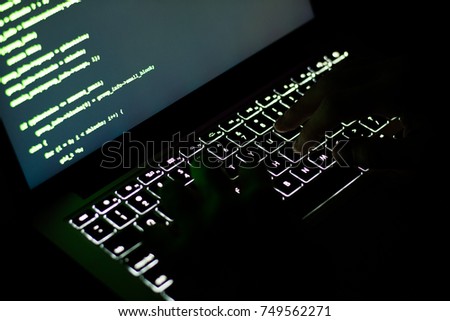 Hacker`s hands on the keybord while coding