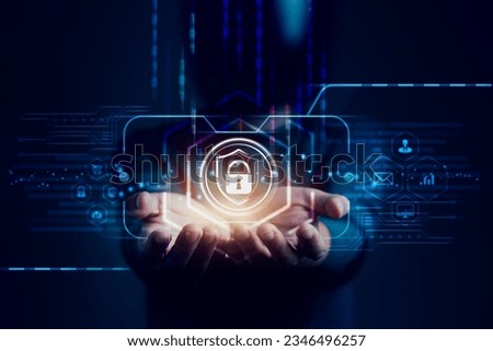 Hacker's hands as they hold the firewalls and multi media icons on a virtual screen, cybercrime, security, privacy, the dark side of technology and the urgent need for cybersecurity measures