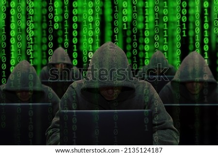 Hackers are sitting at laptops and computers on an abstract background, attacking and hacking servers with a virus. Creation and dissemination of disinformation, DDOS attack 1.