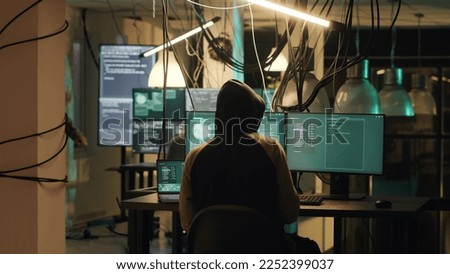 Hackers trying to steal online data late at night, planting virus and malware to manipulate computer system. Criminals doing cyber crime and illegal activities, dark web espionage. Tripod shot.