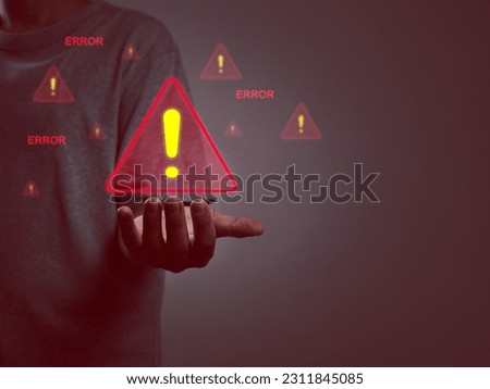 Hacking alert system warning, businessman hand showing cyber attack warning sign on computer network. Spyware, malware, virus. Faulty development. System malfunction notification