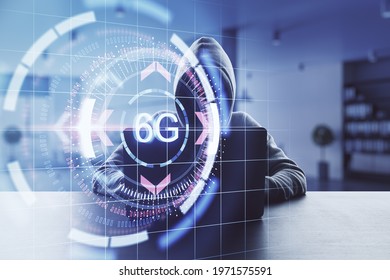 Hacking and cyber security concept with digital button with 6G inscription on no face hacker working on laptop background