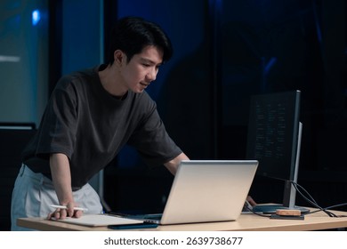 Hacking and malware concept. Hacker using abstract laptop with binary code digital interface. 