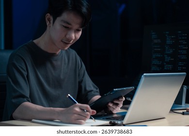 Hacking and malware concept. Hacker using abstract laptop with binary code digital interface. 